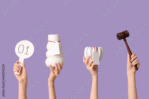 Female hands with auction p...