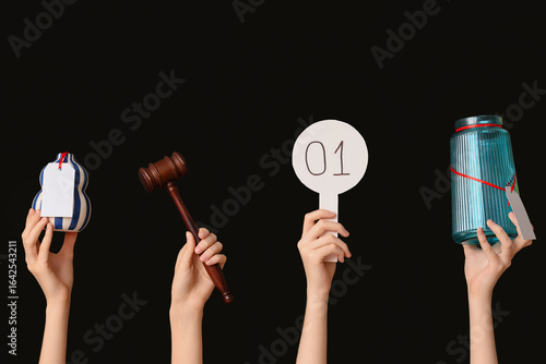 Female hands with auction p...