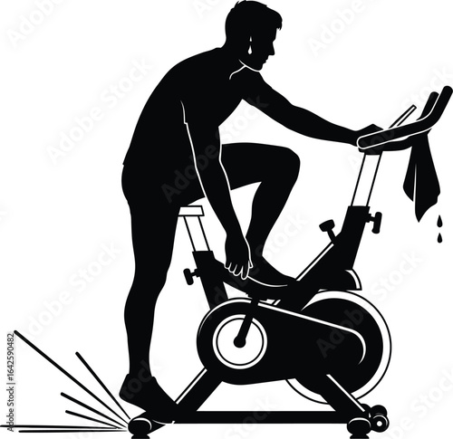 A man is exercising a stationary bike, he is working out in the gym to improve his fitness and health, engaging in a cardio activity for a healthy lifestyle