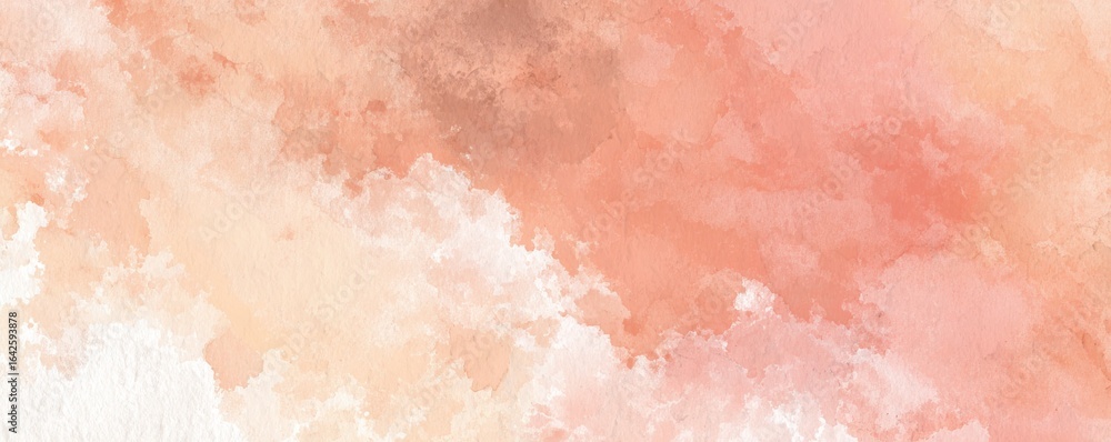 Fototapeta premium Muted peach watercolor paint creates a soft, ethereal texture across the background