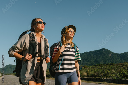 Focused hikers under a clear sky