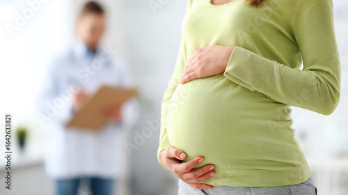 Pregnant woman in a doctor s office with a medical professional in the background