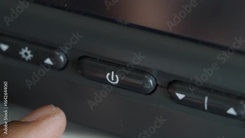 Wallpaper Mural User interacts with power button on electronic device Torontodigital.ca