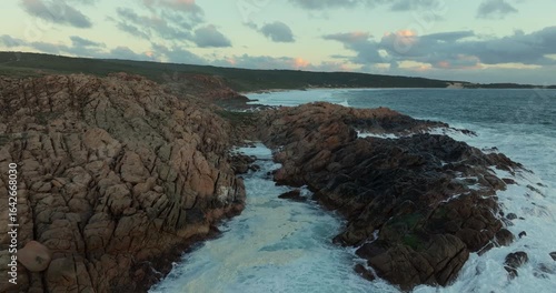 4k Aerial views of rugged rocky coastline in South West Australia at sunset