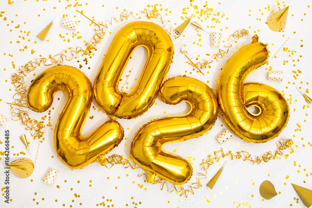 © Sibila and Pavel/Stocksy - Celebration With Golden Balloons and Confetti for New Year 2026