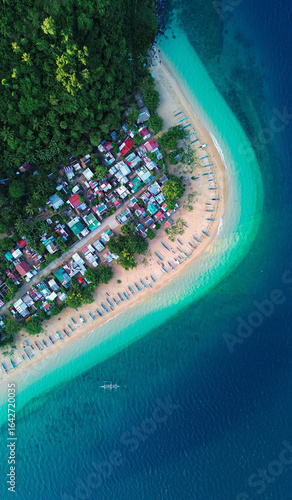 Top view of traditional fishing boats on a scenic island beach.