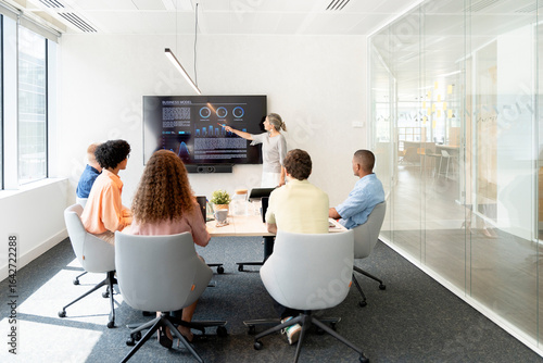 Business team meeting: analyzing data and discussing business model