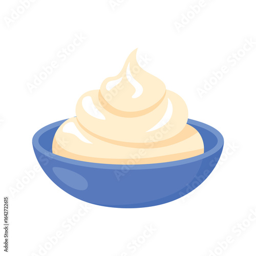 Creamy mayonnaise or whipped cream in a blue bowl