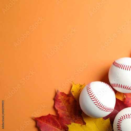 Baseballs and colorful autumn leaves create a perfect fall sports scene