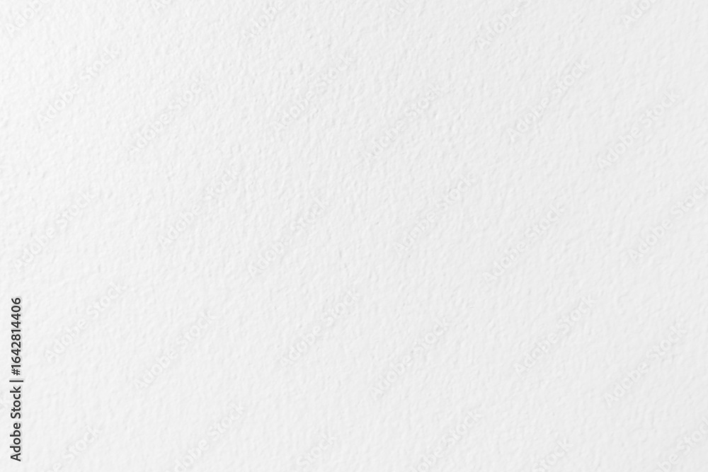 Fototapeta premium Plain white textured wall with subtle grainy details