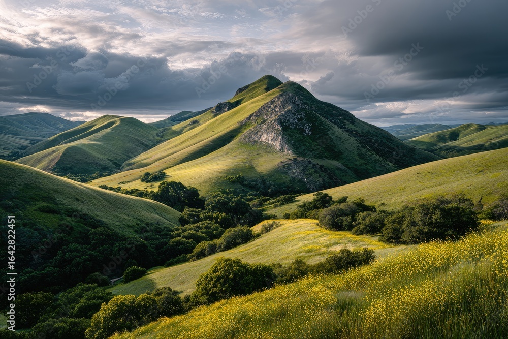 Fototapeta premium Mountain valley, dramatic light, rolling hills