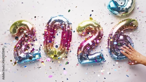 Happy new year 2026 balloons with colorful confetti