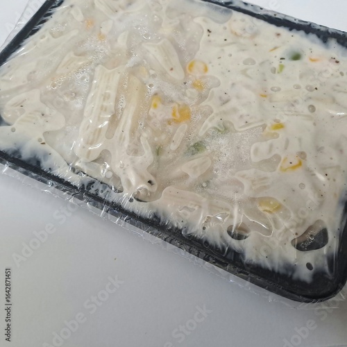 Delicious white sauce pasta close-up