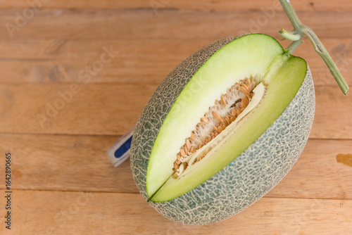 Wallpaper Mural Closeup to Fresh green melon on wood plate Torontodigital.ca