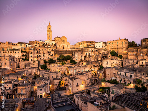 Wallpaper Mural Sunset in the beautiful Sassi of Matera, with stone houses and streets, covered in warm golden light  Torontodigital.ca