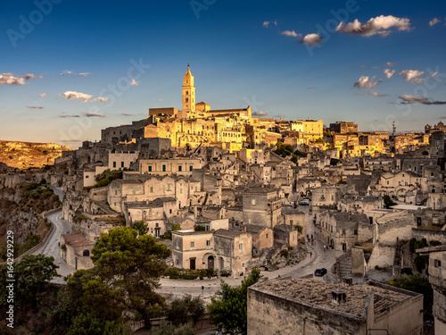 Wallpaper Mural Sunset in the beautiful Sassi of Matera, with stone houses and streets, covered in warm golden light  Torontodigital.ca