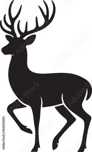 Silhouette of a majestic stag with large antlers, walking gracefully