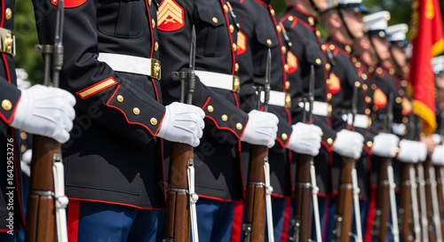 A precision line of United States Marines in their dress blue uniforms holding rifles stands at attention a powerful display of military discipline and honor