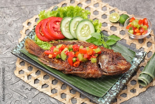 Ikan Nila Bakar. Grilled tilapia with dabu-dabu chili sauce