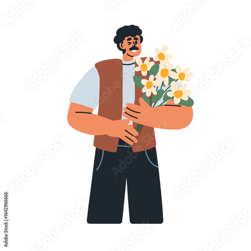 Man with field flower bouquet in hand, smiling. Happy male holding floral bun...