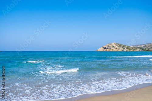 view of the waves on the beach with the sea