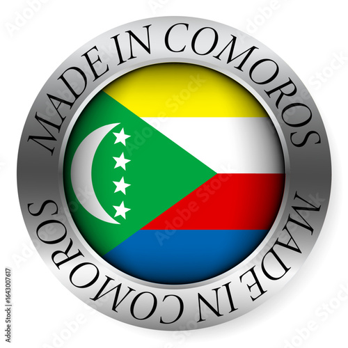 Made in Comoros button icon. Circular emblem with metallic border, glossy central flag, and bilingual label indicating product origin and international manufacturing identity.