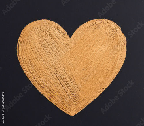 Hand sketched heart in orange color on black background, symbolizing love