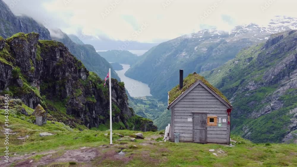 Lonely cabin in Norvegian mountains, looking over to the fjords. Lonely cabin in Norvegian mountains, looking over to the fjords.