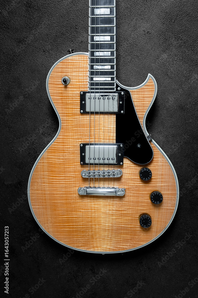 Fototapeta premium Electric guitar with natural pattern isolated on black background.