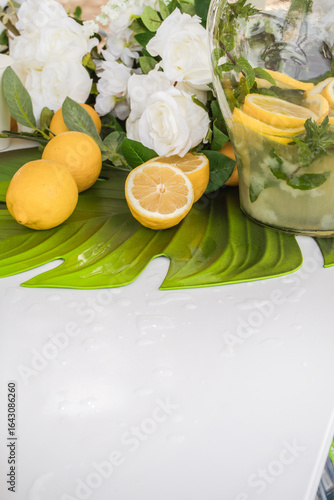 fresh lemons on green leaf surface