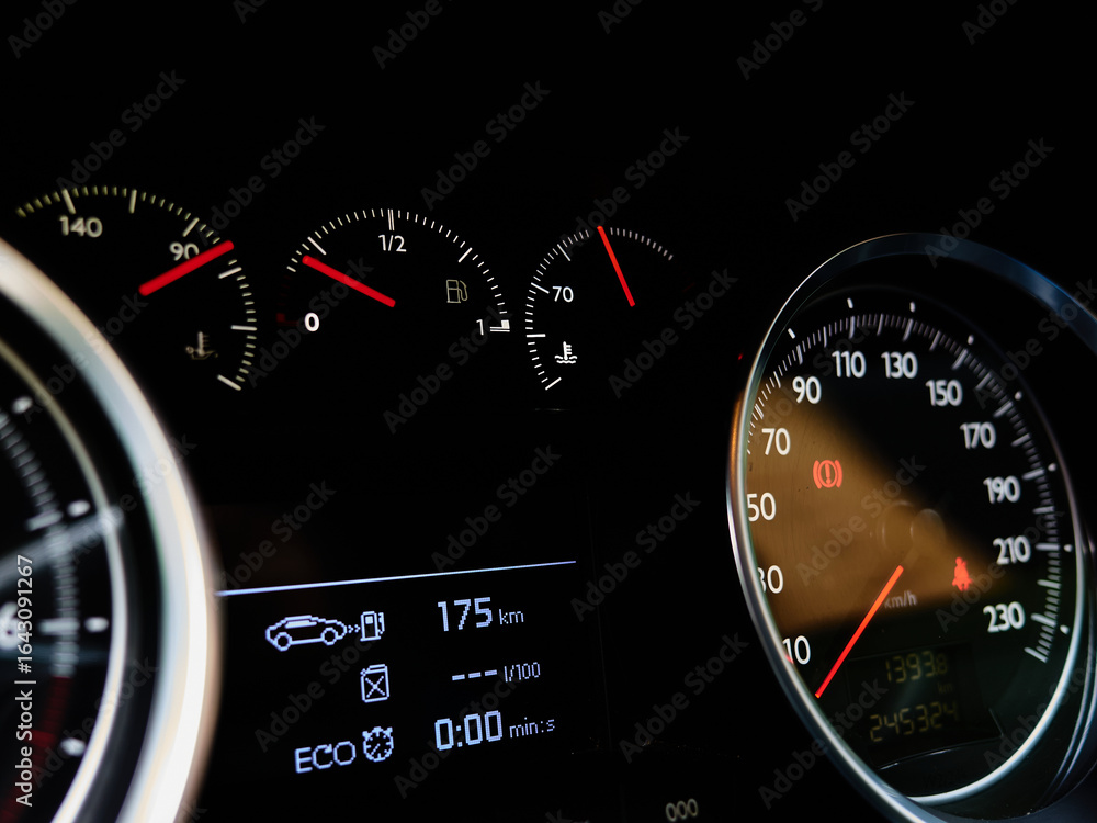 Fototapeta premium Car speedometer at zero on illuminated vehicle dashboard