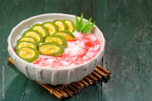 Es Pisang Ijo. Green banana ice is a type of typical food from the Makassar tribe in South Sulawesi. This food is made from bananas coated with green flour dough