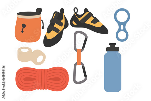 Climbing gear arranged in a neat layout showing important equipment for rock climbing activities