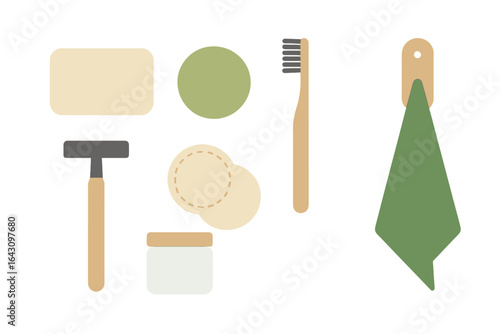 Various personal care items arranged neatly on a clean surface with a green cloth and wooden toothbrush
