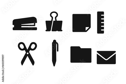 Office supplies including stapler, scissors, binder clip, ruler, pen, folder, sticky note, and envelope on a clean surface