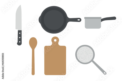 Various kitchen utensils arranged on a countertop for cooking preparation and meal planning