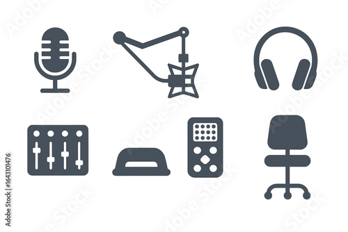 Studio equipment setup featuring microphone, headphones, and sound mixer for audio recording sessions