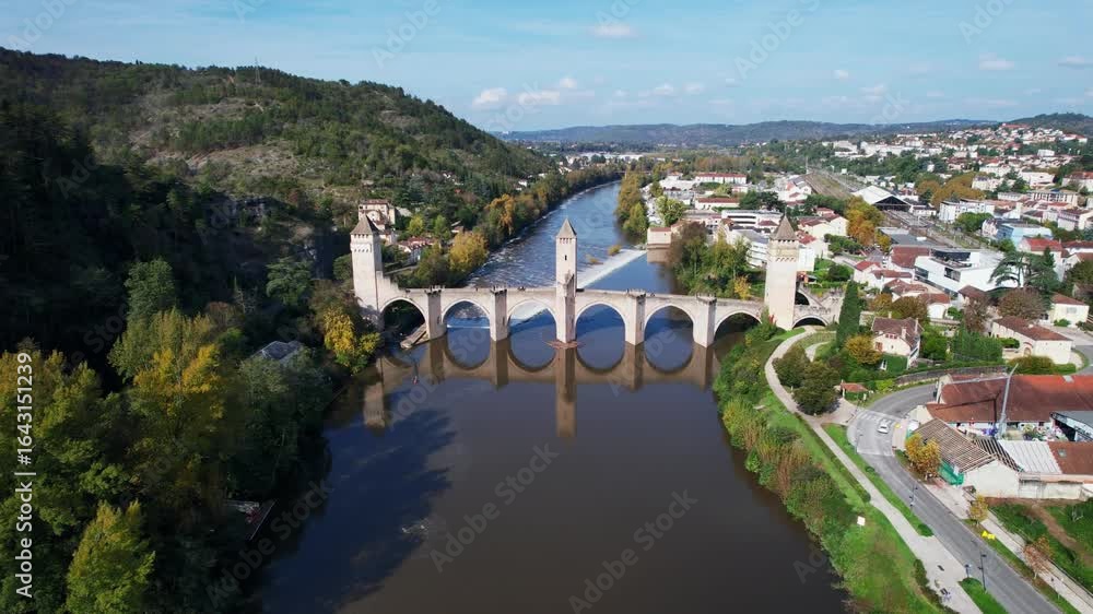 Scenic aerial view of historic Valentré bridge and river in calm atmosphere Scenic aerial view of historic Valentré bridge and river in calm atmosphere