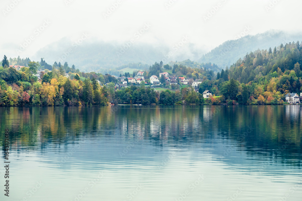 Fototapeta premium The magical atmosphere of Lake Bled in autumn. Among boats and mystical charm. Slovenia