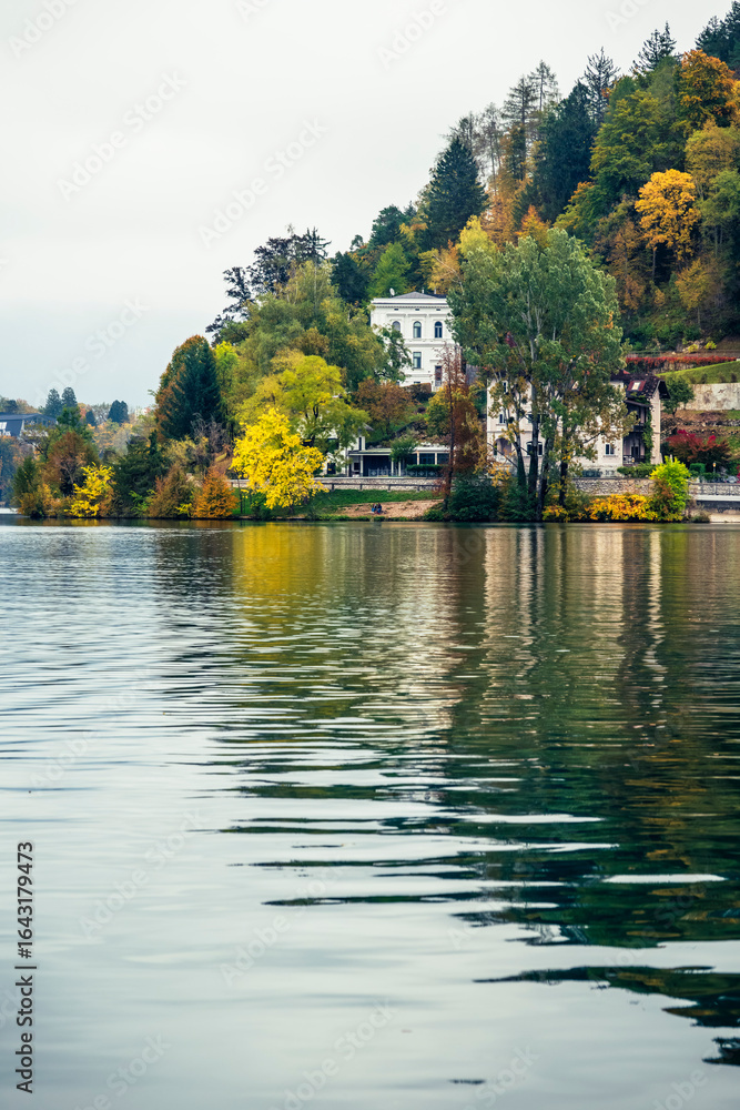 Fototapeta premium The magical atmosphere of Lake Bled in autumn. Among boats and mystical charm. Slovenia