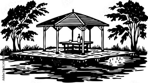 A shaded gazebo surrounded by trees, offering a serene retreat by the water.