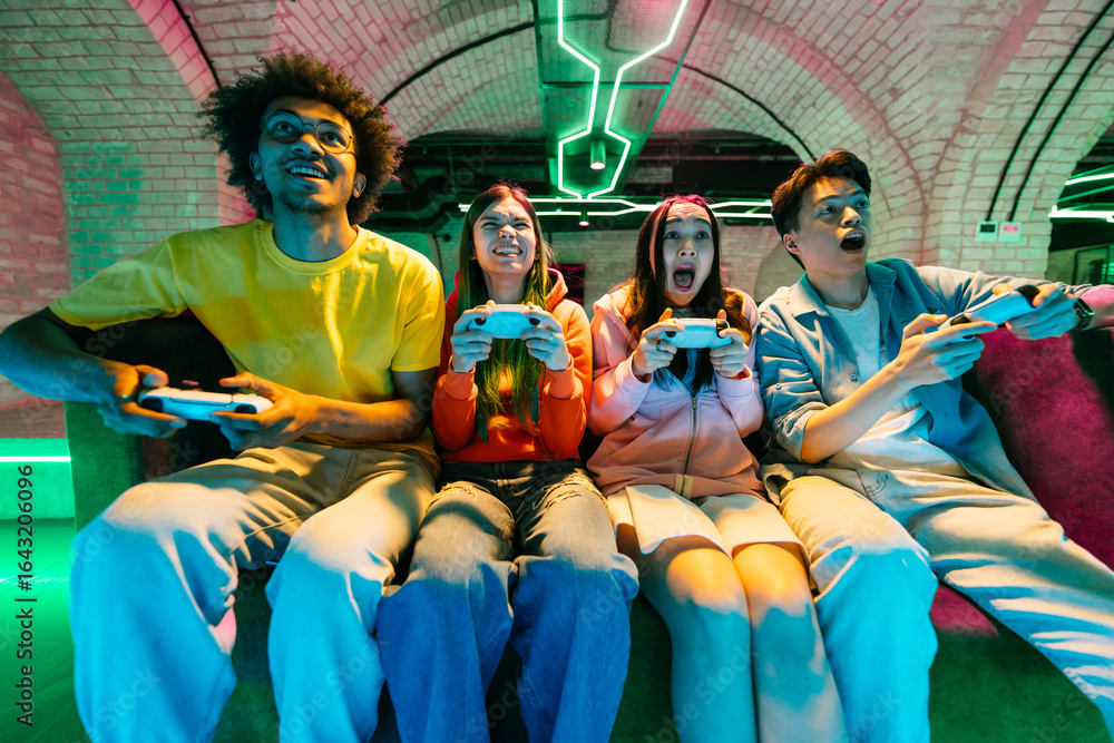 custom made wallpaper toronto digitalMultiethnic group of young friends playing videogames at home