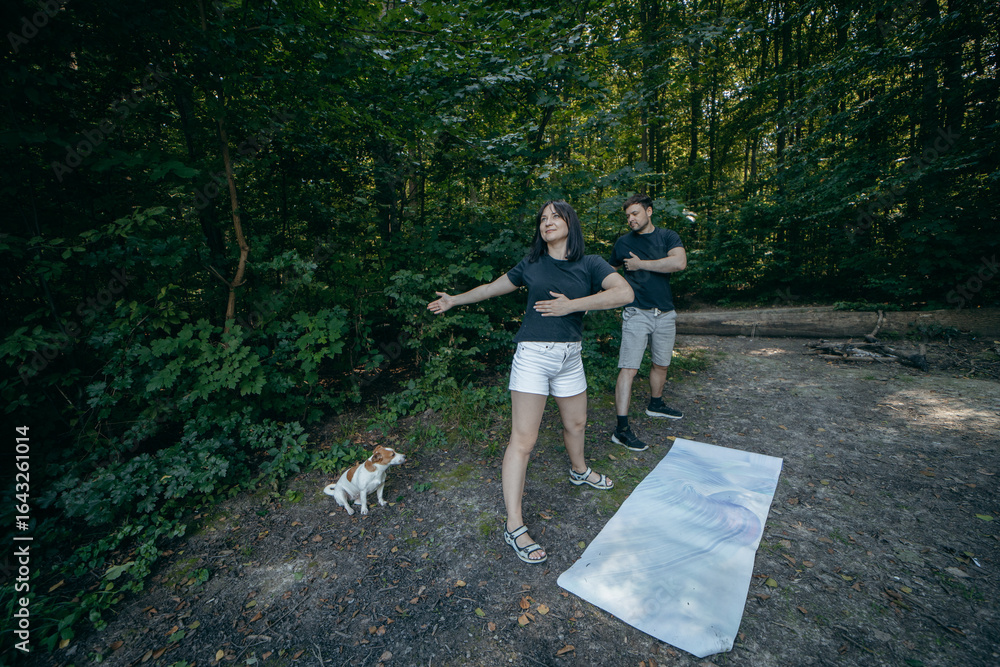 Fototapeta premium Adult couple relax at nature near lake at summer