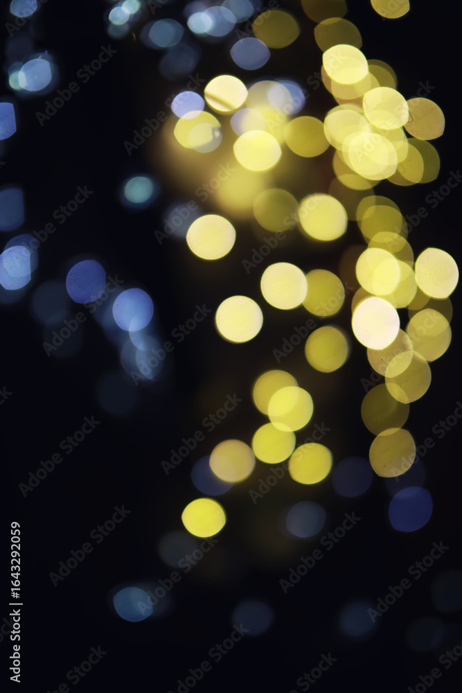 Obraz premium Abstract bokeh background. Golden bokeh circles on dark blue background. Layer overlay.