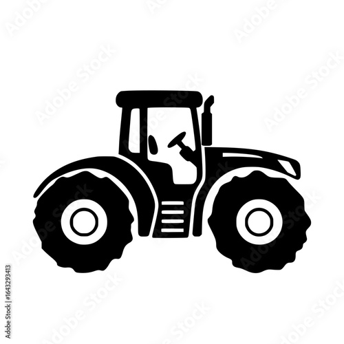 Farm tractor working on a field during early morning hours, showcasing agricultural machinery and countryside landscape