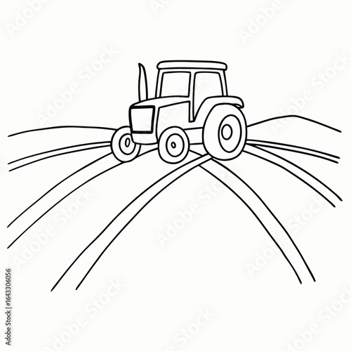 Agricultural tractor on farmland with furrows for farming and harvesting with copy space for national farmers day
