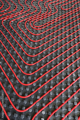 Fotomural Tubes of radiant underfloor heating installation