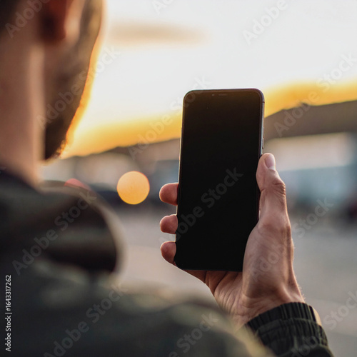 Person Holding Smartphone with Blank Screen for AI Chat