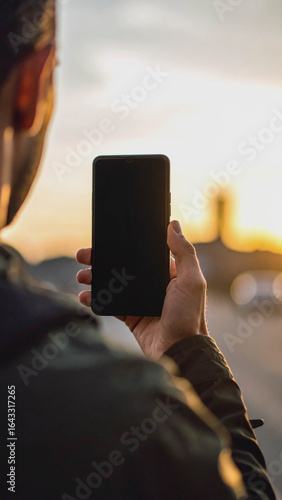  Person Holding Smartphone with Blank Screen for AI Chat