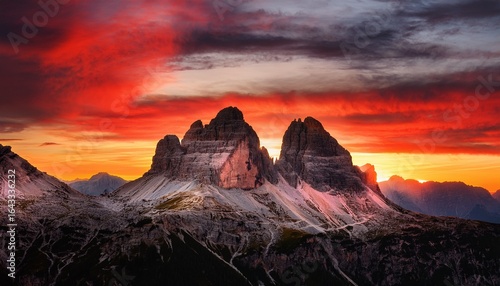 fiery red skies over the majestic dolomite mountains a sunset spectacle